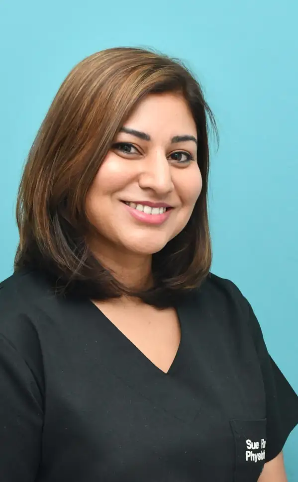 Staff member smiling in uniform